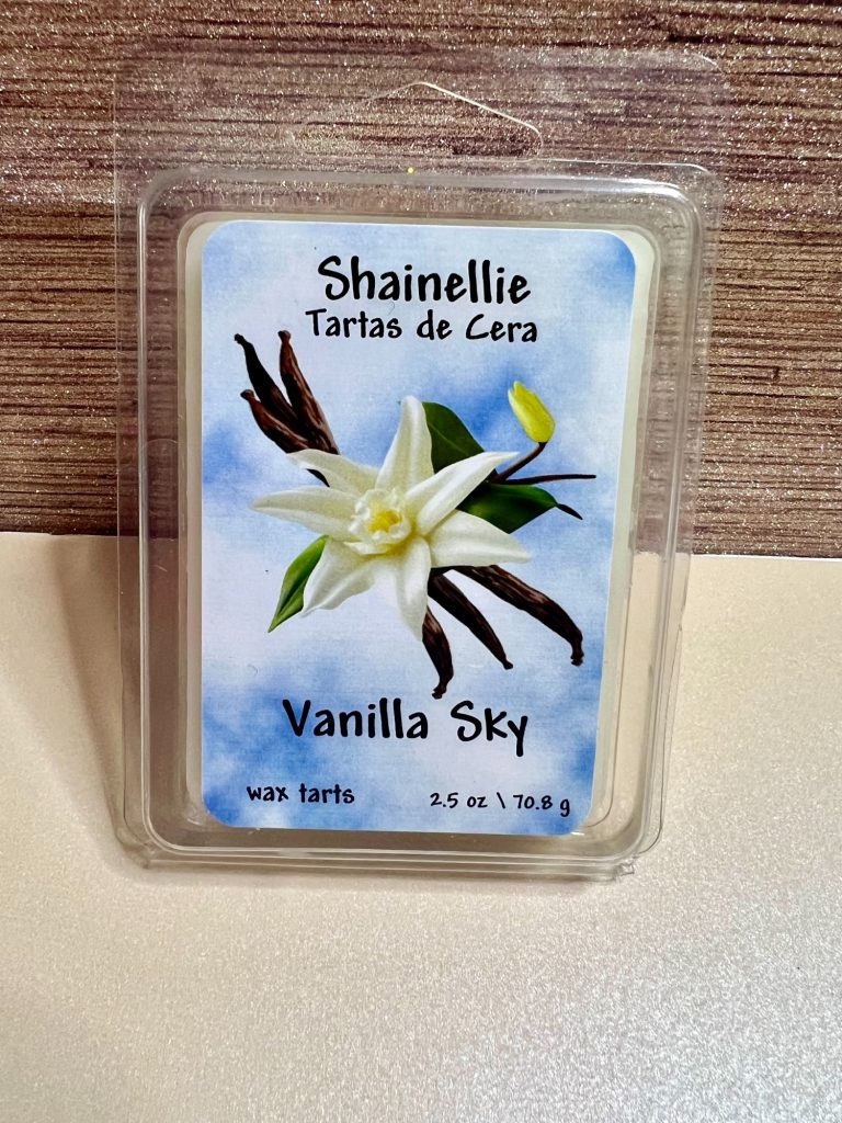 Vanilla Sky Vanilla Sky wax melt packaging featuring a white flower on a blue background.